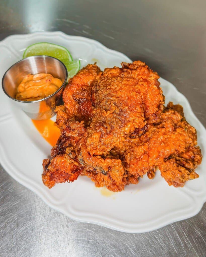 Crispy fried chicken with dipping sauce at MM Diner